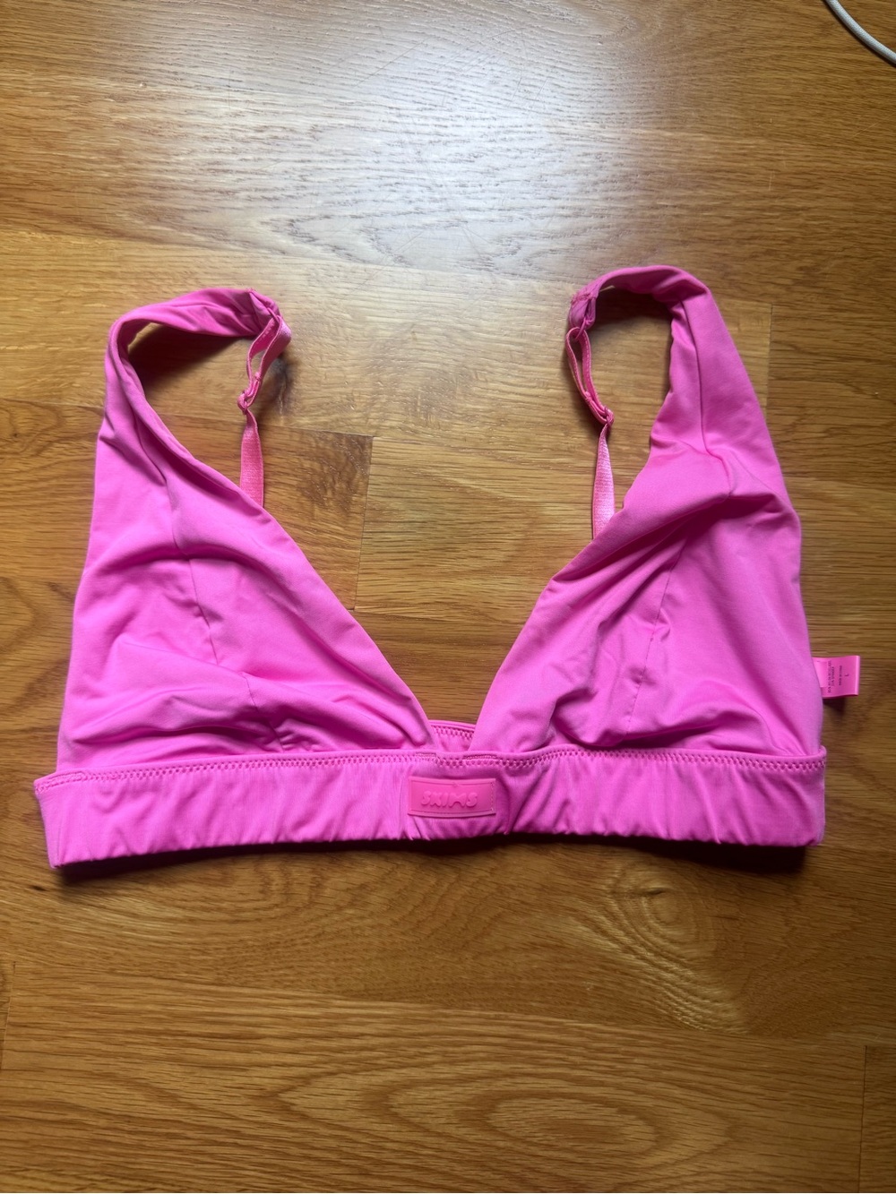 SKIMS Wireless Triangle Bralette in Vibrant Pink size L
